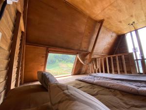 Letto o letti in una camera di Satha private villa Dieng