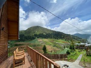 a balcony with a view of a mountain at Satha private villa Dieng in Banjarnegara