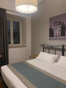 Voodi või voodid majutusasutuse Hotel dei Gonzaga, MantegnaHotels toas