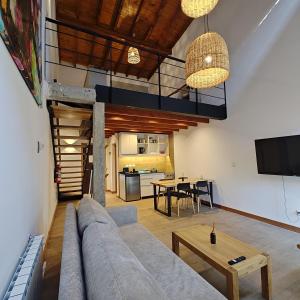 a living room with a couch and a table at ANFITEATRO APARTS & LOFTS in San Carlos de Bariloche