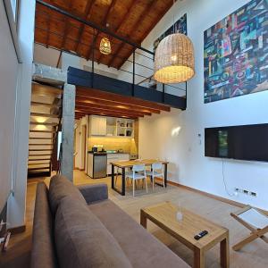 a living room with a couch and a table at ANFITEATRO APARTS & LOFTS in San Carlos de Bariloche