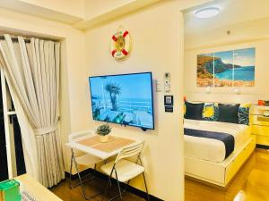 TV i/ili multimedijalni sistem u objektu CELANDINE Residence by DMCI