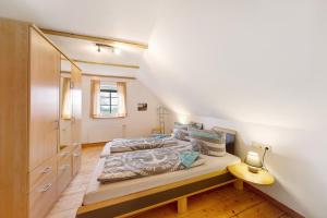 a bedroom with two beds in a room at Galerie Haus Wohnung 3 in Sehestedt +26 photos