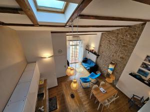 an overhead view of a living room with a table and chairs at LA MAISON SUR LE PORT 4 pers vue mer in Cassis