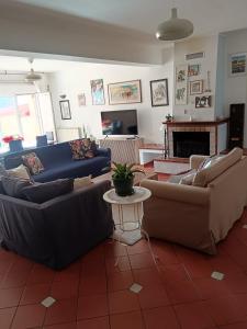 a living room with two couches and a table at Da Carlotta in Castel di Sangro