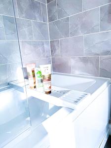 a shelf in a refrigerator with two products on it at 3Bed House For Contractors Large Group Sleep upto9 in Birmingham +30 photos