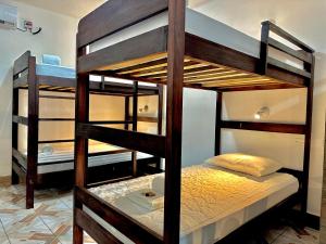 a couple of bunk beds in a room at Hotel San Miguel in Flores