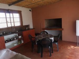 a dining room with a table and chairs in a room at Bremen Guestfarm in Grünau