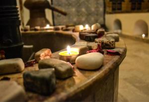 a bunch of donuts with candles on a table at Dar Zaghouan in Zaghouan