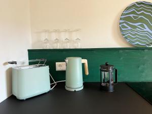 a counter with a toaster and a blender on it at Kolberg Studio - Moderne Ferienwohnung in Boppard in Boppard