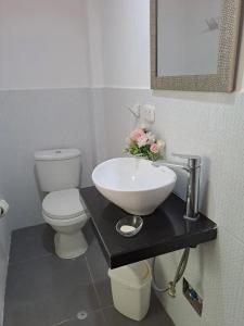 a bathroom with a sink and a toilet at La Casa de Benito in Lima