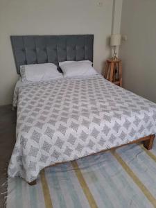 Łóżko lub łóżka w pokoju w obiekcie La Casa de Benito