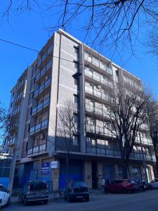 a large building with cars parked in front of it at B&Bononia View in Bologna
