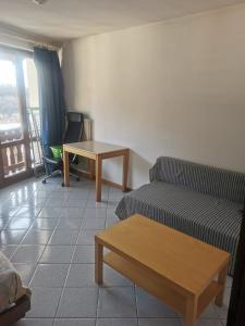 a living room with a couch and a table at Casa Viarago in Pergine Valsugana