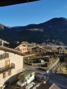 a view of a town with a mountain in the background at Casa Viarago in Pergine Valsugana