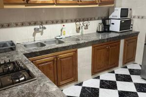 a kitchen with a sink and a counter top at Beautiful Sea View Apartment in Tangier in Tangier