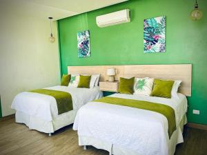 Ein Bett oder Betten in einem Zimmer der Unterkunft Hotel Cabelas