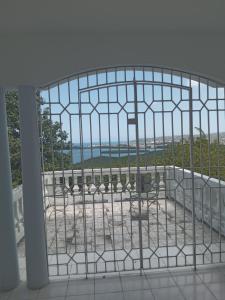 a view from a balcony with a fence at OCEANView in Montego Bay