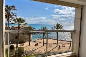 a view of the ocean from a window at Antibes sea view near Ilette - Sleeps 4 - Parking in Antibes