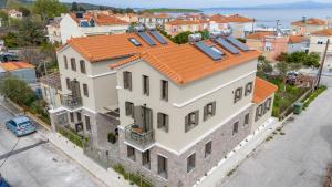 an aerial view of a building with an orange roof at Akti Vigla Apartments in Mytilini