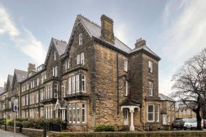 a large brick building on the side of a street at Charming Granby Flat in Harrogate
