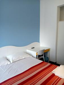 A bed or beds in a room at Albergo Belvedere