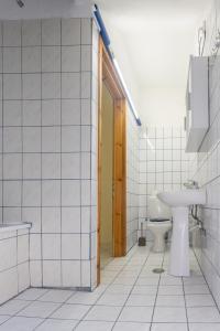 a bathroom with a toilet and a sink at RENT HOUSE BEACH MIRTOFITO 8 km FROM PERAMOS in Elaiokhórion +38 photos