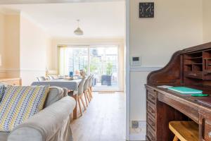 a living room with a table and a couch at Tideway in Whitstable