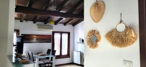 a room with a table and a mirror on the wall at Appartamento Garda Star in Cavalcaselle