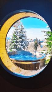 a circular picture of a pool of water in a building at SudoLand Orava in Oravská Lesná