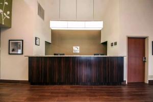 a lobby with a reception desk in a building at Sleep Inn and Suites Central / I-44 in Tulsa