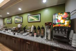 a kitchen with a counter with a coffee maker at Sleep Inn and Suites Central / I-44 in Tulsa