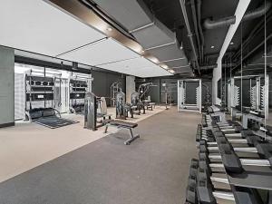 a gym with rows of chairs and machines in a room at Luxury 1 Bedroom 1Bath Convention Center in Seattle