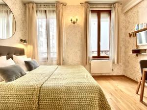Postel nebo postele na pokoji v ubytování CamParis - B&B - Chambre d'hôtes