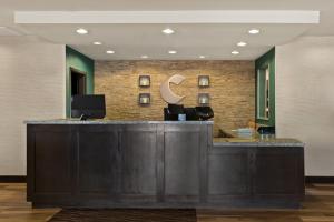 a hotel lobby with a reception desk with a crescentrescent at Comfort Inn & Suites Newcastle - Oklahoma City in Newcastle