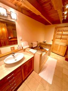 a bathroom with a sink and a counter top at Big Bear Cabin in Corning +11 photos
