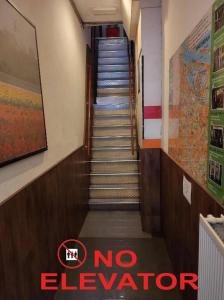 a stairway with a no elevator sign on it at International Budget Hostel City Center in Amsterdam