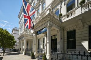 a building with a british flag on it at The Queens Gate Hotel in London