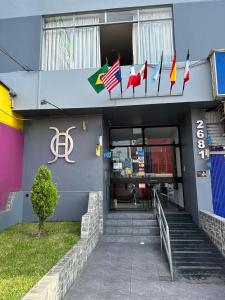 a building with flags on the side of it at Hospedaje Oscar's in Lima