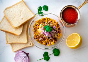 a bowl of food with bread and a bowl of salsa at Backpacker - Stay Villa Delhi Airport in New Delhi