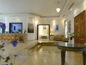 a lobby with a table and a living room at Private Room Villa Dubai in Dubai