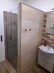 Koupelna v ubytování Neubauer Vendégház*** Mohács + 24 fotografií