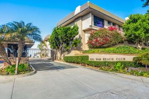 a building with a sign that reads all my beach club at Del Mar Gem condo in Solana Beach