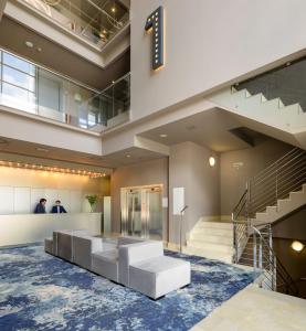 a lobby of a building with a staircase at Hotel Antik San Sebastián in Donostia-San Sebastián