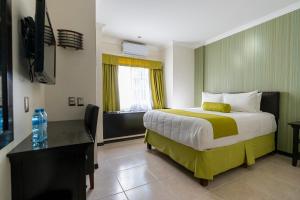 Postel nebo postele na pokoji v ubytování Hotel Ocean View