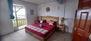 Postel nebo postele na pokoji v ubytování Residence le bijou mourouk rodrigues