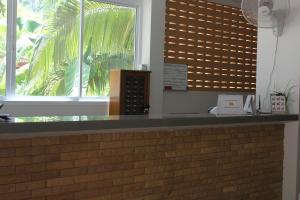 a counter in a restaurant with a large window at N.D.Hotel in Ko Lanta