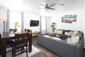 a living room with a couch and a table at 3 Bedroom 2 Bath House with Parking - 10 Guests in San Diego