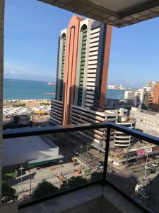 a view of a city from a balcony at Via Venetto Flat Temporada in Fortaleza