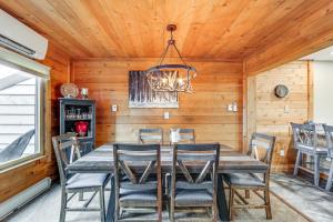 a dining room with a table and chairs at Pristine Resort Townhome 2 Mi to Seven Springs Mtn in Champion